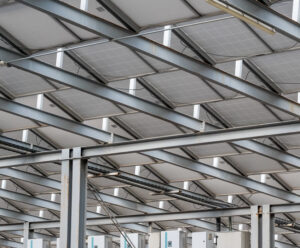 A solar farm in TCI which is also called a community solar project installed in a field.