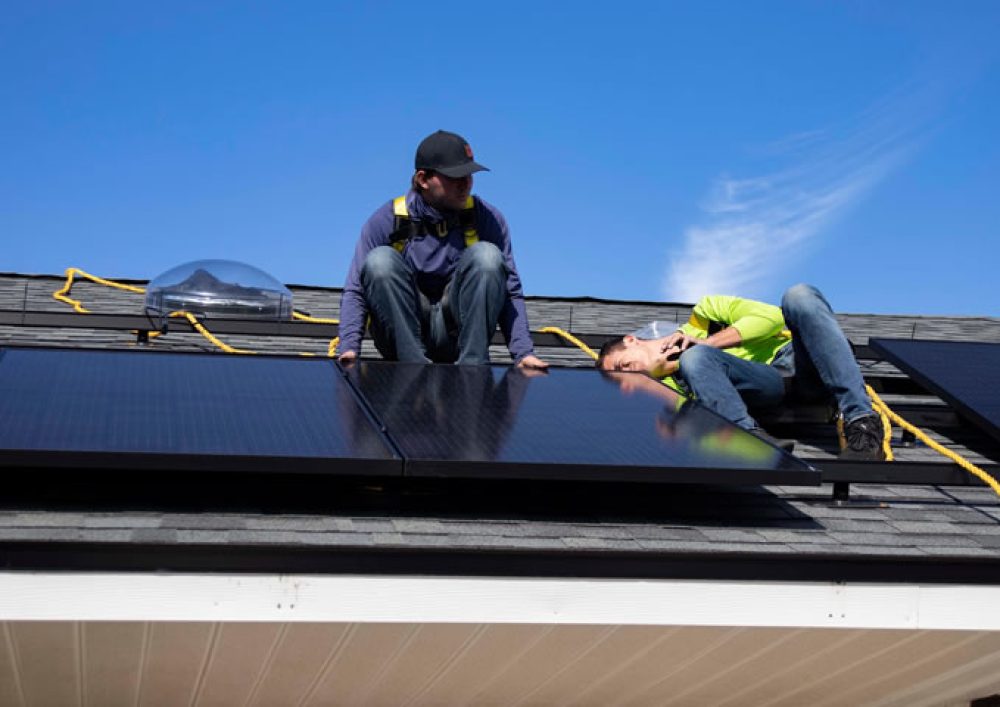 Repairmen doing solar power repairs